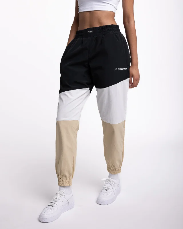 Women's Faux Leather Tight Trousers with Studded Details in Brown for an Edgy StyleHarvey Bottoms - Black/White/Beige Women's Faux Leather Tight Trousers with Studded Details in Brown for an Edgy StyleHarvey Bottoms - Black/White/Beige