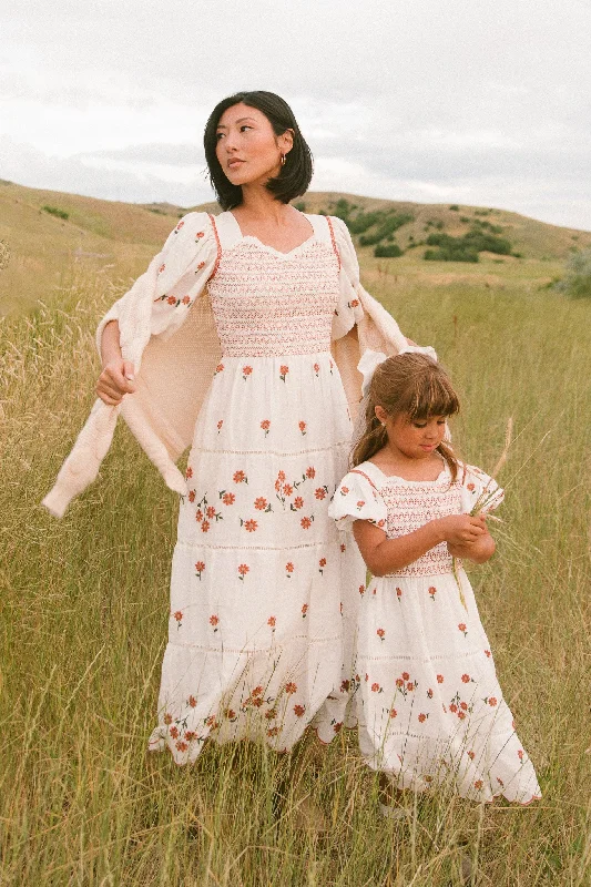 Ruffled maxi dresses with a tiered skirt for added volumeGreta Midi Dress in Rust Floral Ruffled maxi dresses with a tiered skirt for added volumeGreta Midi Dress in Rust Floral